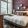 furnished, carpeted bedroom with large windows