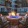Courtyard with fire pit surrounded by cushioned chairs